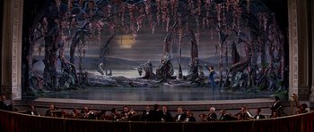 Movie still from “Funny Girl” (1968), directed by William Wyler – A scene of a scene in a theater with people sitting and standing around it; Extreme Wide shot, High angle