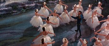 Movie still from “Funny Girl” (1968), directed by William Wyler – A group of ballerinas in white tutus dancing in the water; Wide shot, High angle