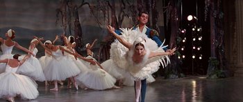 Movie still from “Funny Girl” (1968), directed by William Wyler – A group of ballet dancers performing in front of a forest; Wide shot, Low angle