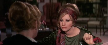 Movie still from “Funny Girl” (1968), directed by William Wyler – A woman wearing a head scarf is talking to another woman; Close Up shot, Over the shoulder angle