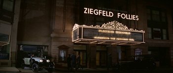 Movie still from “Funny Girl” (1968), directed by William Wyler – People are standing in front of the ziegfeld folger theatre; Wide shot, High angle