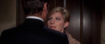 Movie still from “Funny Girl” (1968), directed by William Wyler – A man and a woman are looking into each others eyes; Close Up shot, Over the shoulder angle