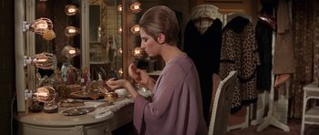 Movie still from “Funny Girl” (1968), directed by William Wyler – A woman sitting in front of a mirror in a dressing room; Medium shot, High angle