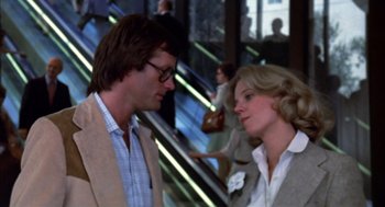 Movie still from “Futureworld” (1976), directed by Richard T. Heffron – A man and a woman talking to each other; Medium shot, Low angle
