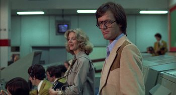 Movie still from “Futureworld” (1976), directed by Richard T. Heffron – A man and a woman standing next to each other; Medium shot, Low angle