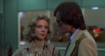 Movie still from “Futureworld” (1976), directed by Richard T. Heffron – A man and a woman standing next to each other; Close Up shot, Over the shoulder angle