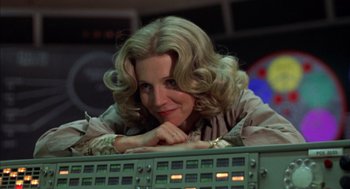 Movie still from “Futureworld” (1976), directed by Richard T. Heffron – A woman with blonde hair leaning on a computer keyboard; Close Up shot, Low angle