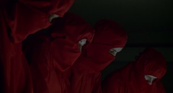 Movie still from “Futureworld” (1976), directed by Richard T. Heffron – A group of people wearing red and white hoods; Close Up shot, Low angle
