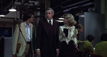 Movie still from “Futureworld” (1976), directed by Richard T. Heffron – A group of people walking in a room; Medium shot, Low angle