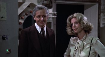 Movie still from “Futureworld” (1976), directed by Richard T. Heffron – A man and a woman standing next to each other; Medium shot, Low angle