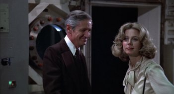 Movie still from “Futureworld” (1976), directed by Richard T. Heffron – A man and a woman standing next to each other; Medium shot, Over the shoulder angle