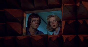 Movie still from “Futureworld” (1976), directed by Richard T. Heffron – A man and a woman looking out of a window; Close Up shot, Low angle