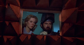 Movie still from “Futureworld” (1976), directed by Richard T. Heffron – A man and a woman looking out of a window; Close Up shot, Low angle