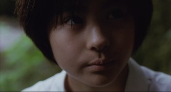 Movie still from “Gamera 3: Revenge of Iris” (1999), directed by Shûsuke Kaneko – A young person's face; Close Up shot, High angle
