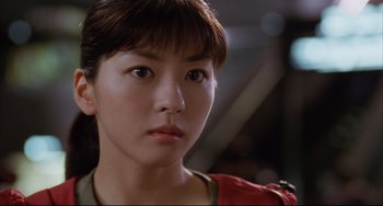 Movie still from “Gamera 3: Revenge of Iris” (1999), directed by Shûsuke Kaneko – A person wearing a red jacket; Close Up shot, Low angle