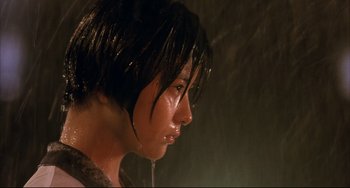 Movie still from “Gamera 3: Revenge of Iris” (1999), directed by Shûsuke Kaneko – A person with water on their face; Close Up shot, Low angle