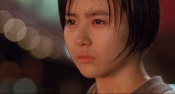 Movie still from “Gamera 3: Revenge of Iris” (1999), directed by Shûsuke Kaneko – A person with wet hair; Close Up shot, Low angle