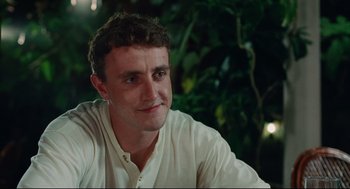 Movie still from “Aftersun” (2022), directed by Charlotte Wells – A person wearing a white shirt; Close Up shot, Low angle