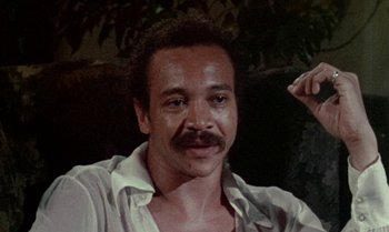 Movie still from “Ganja & Hess” (1973), directed by Bill Gunn – A person with a mustache; Close Up shot, High angle