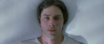 Movie still from “Garden State” (2004), directed by Zach Braff – A person laying in a bed; Close Up shot, Overhead angle