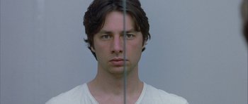 Movie still from “Garden State” (2004), directed by Zach Braff – A young man is looking into the mirror; Close Up shot, Overhead angle
