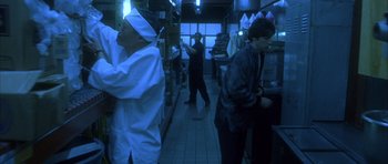 Movie still from “Garden State” (2004), directed by Zach Braff – A group of people standing in a kitchen; Medium shot, Low angle