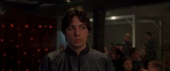Movie still from “Garden State” (2004), directed by Zach Braff – A young man in a black and gray jacket; Close Up shot, Over the shoulder angle