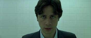 Movie still from “Garden State” (2004), directed by Zach Braff – A person wearing a suit and tie; Close Up shot, Low angle