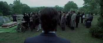 Movie still from “Garden State” (2004), directed by Zach Braff – A group of people standing in the grass; Wide shot, Over the shoulder angle