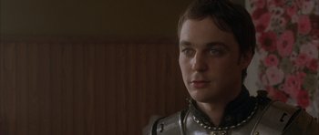 Movie still from “Garden State” (2004), directed by Zach Braff – A young man in a suit of the middle ages; Close Up shot, Over the shoulder angle