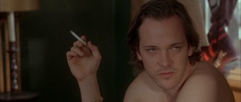 Movie still from “Garden State” (2004), directed by Zach Braff – A person holding a cigarette; Close Up shot, Over the shoulder angle