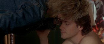 Movie still from “Garden State” (2004), directed by Zach Braff – A man with a camera taking a picture of another man's face; Close Up shot, Over the shoulder angle