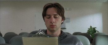 Movie still from “Garden State” (2004), directed by Zach Braff – A man sitting in front of a laptop computer; Close Up shot, Low angle