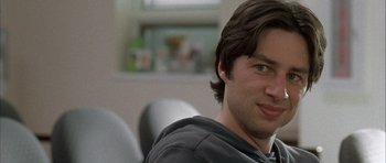 Movie still from “Garden State” (2004), directed by Zach Braff – A person sitting in a chair; Close Up shot, Over the shoulder angle