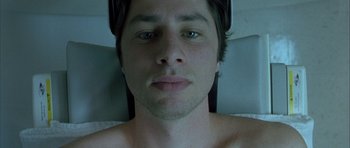 Movie still from “Garden State” (2004), directed by Zach Braff – A man's face in a bed; Close Up shot, Overhead angle