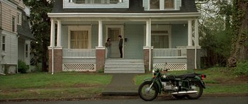 Movie still from “Garden State” (2004), directed by Zach Braff – A motorcycle parked in front of a house; Wide shot, High angle