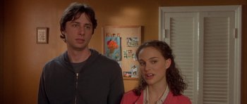 Movie still from “Garden State” (2004), directed by Zach Braff – A man and a woman standing next to each other in a room; Medium shot, Over the shoulder angle