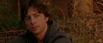 Movie still from “Garden State” (2004), directed by Zach Braff – A person sitting in a chair; Close Up shot, Over the shoulder angle
