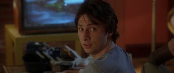 Movie still from “Garden State” (2004), directed by Zach Braff – A person sitting in front of a projector screen; Close Up shot, Over the shoulder angle