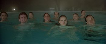 Movie still from “Garden State” (2004), directed by Zach Braff – A group of young people in a swimming pool; Medium shot, High angle