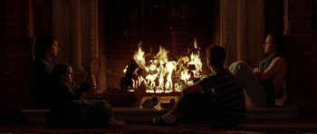 Movie still from “Garden State” (2004), directed by Zach Braff – Two people sitting in front of a fire place; Wide shot, Over the shoulder angle