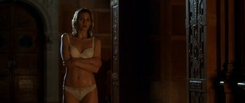 Movie still from “Garden State” (2004), directed by Zach Braff – A woman in white lingerie standing in front of a mirror; Medium shot, Low angle