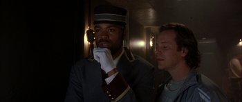 Movie still from “Garden State” (2004), directed by Zach Braff – A man and a woman standing next to each other in a hallway; Close Up shot, Low angle