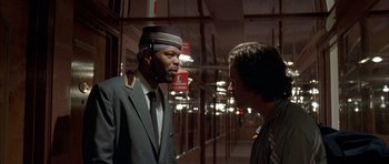 Movie still from “Garden State” (2004), directed by Zach Braff – A man in a suit and tie talking to a man in a suit and tie; Close Up shot, Low angle