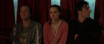 Movie still from “Garden State” (2004), directed by Zach Braff – A woman sitting in front of two other people; Medium shot, High angle