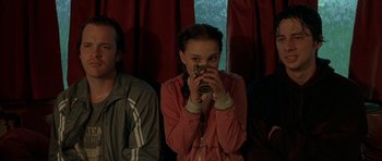 Movie still from “Garden State” (2004), directed by Zach Braff – A young girl taking a picture with her cell phone; Medium shot, Over the shoulder angle