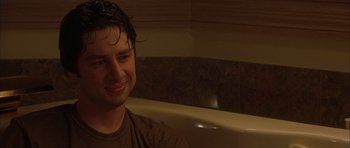 Movie still from “Garden State” (2004), directed by Zach Braff – A man sitting in front of a bath tub in a bathroom; Close Up shot, Over the shoulder angle