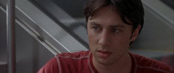Movie still from “Garden State” (2004), directed by Zach Braff – A person wearing a red shirt; Close Up shot, Over the shoulder angle