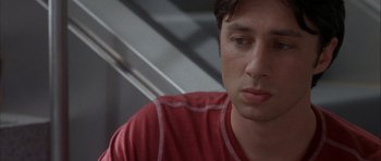 Movie still from “Garden State” (2004), directed by Zach Braff – A person wearing a red shirt; Close Up shot, Low angle