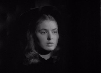 Movie still from “Gaslight” (1944), directed by George Cukor – A black and white photo of a woman with long hair; Close Up shot, High angle